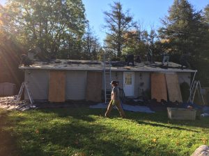 Roofing company installs new shingles