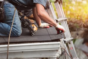 Roofing company installs new shingles