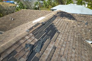 Roofing company installs new shingles