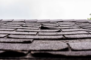 Roofing company installs new shingles