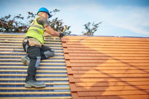Roofing company installs new shingles