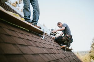Roofing company installs new shingles