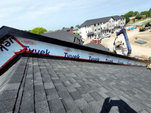 Roofing company installs new shingles