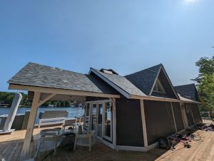 Roofing company installs new shingles