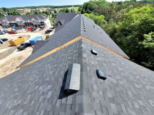Roofing company installs new shingles