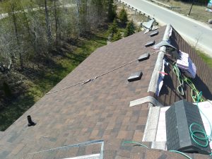 Roofing company installs new shingles