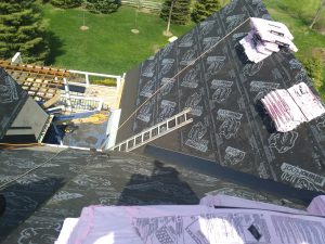 Roofing company installs new shingles