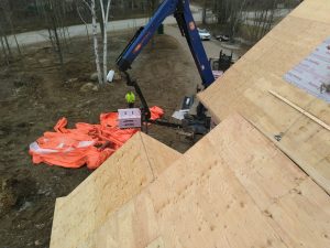 Roofing company installs new shingles