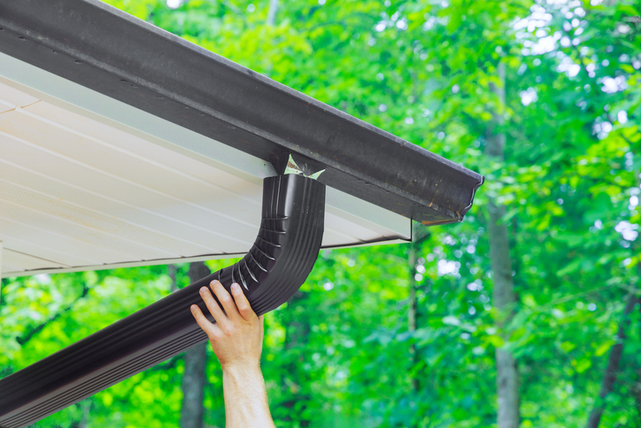 Installing black Eavestrough in Barrie